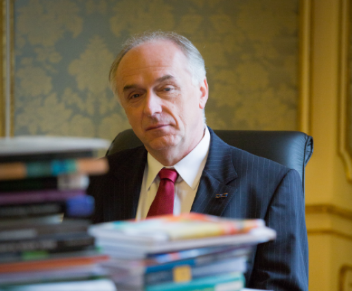 Portrait Photo of Pavel Kabat with books